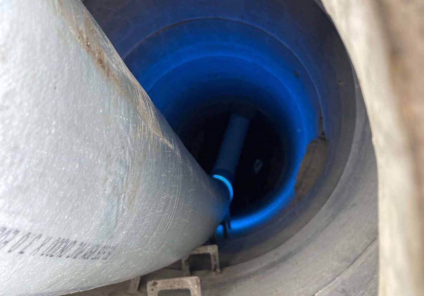 A UV light train curing a new liner inside a damaged pipe